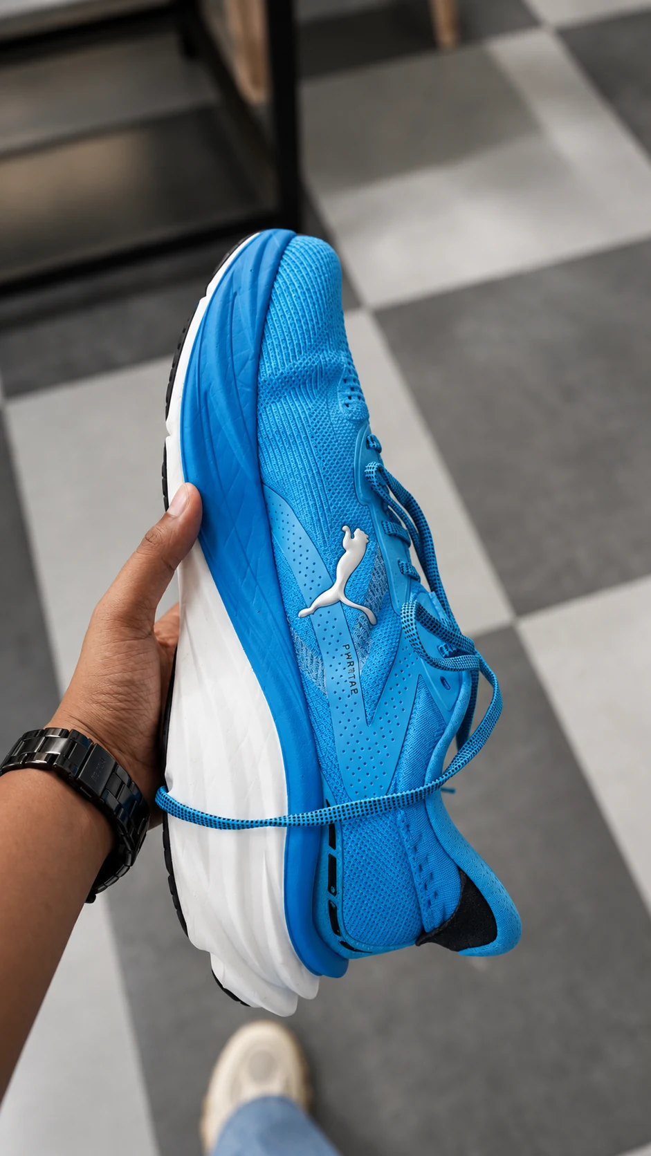 Blue performance shoe photographed after care