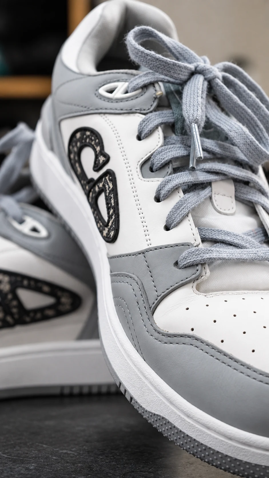 Grey and white sneaker detail at Mr. Shoe Cleaner
